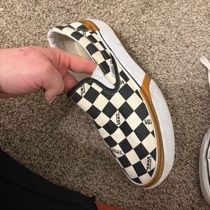 Vans Black and White Checkerboard Slip-Ons with Brown Accent